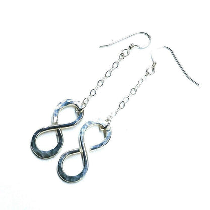 Sterling silver infinity earrings with hammer pattern by Blue Crius, featuring elegant, textured design for stylish wear.