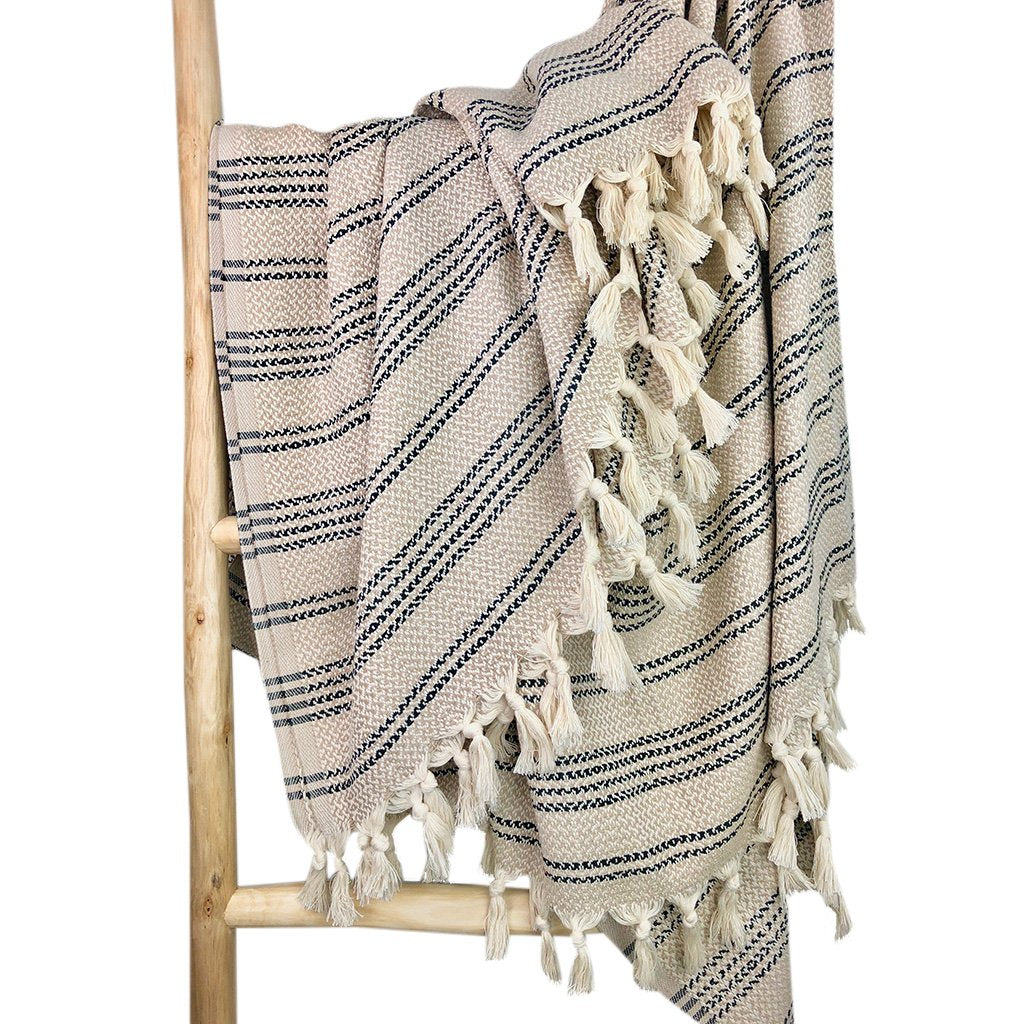 Ariel woven stripe Turkish throw blanket with colorful striped pattern, ideal for home decor and cozying up on the couch.