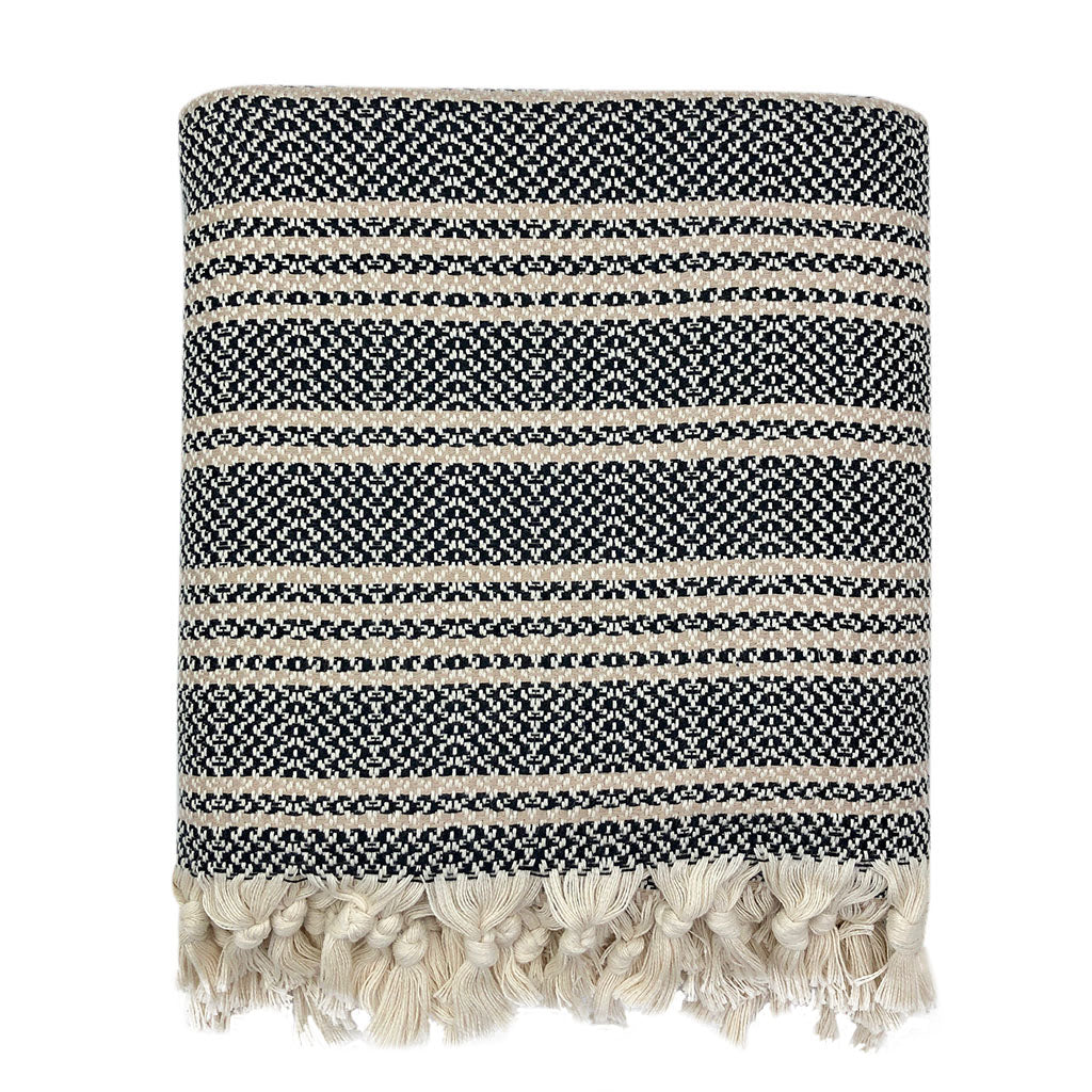 Ariel woven stripe Turkish throw blanket with black and neutral woven pattern, perfect for home decor and cozy accents.