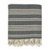 A woven Turkish throw blanket with black and white stripe design, ideal for home decor from Ariel.