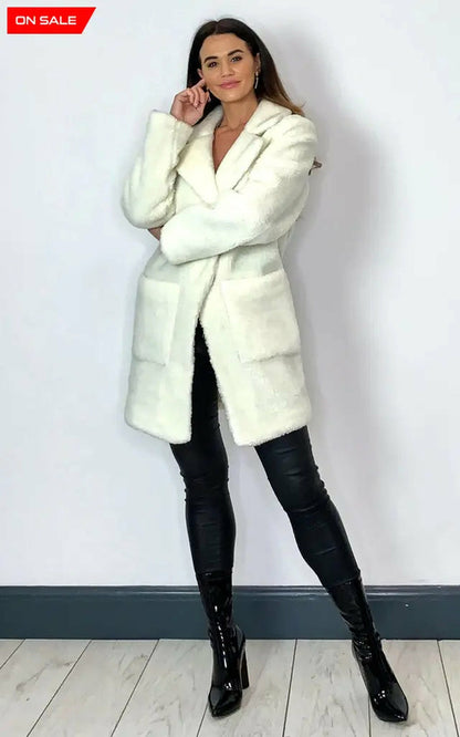 Cream Rose Eleusis Borg Teddy Coat with stud buttons, cozy plush fabric, and a stylish jacket design for cold weather.