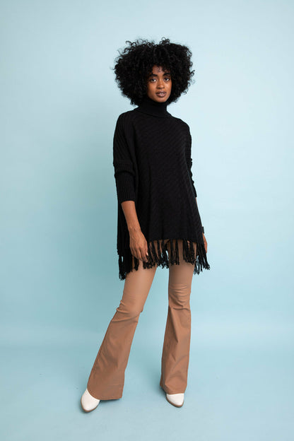 Black roll-neck sweater poncho by Start2Finish, featuring a cozy, stylish design suitable for sweater weather.