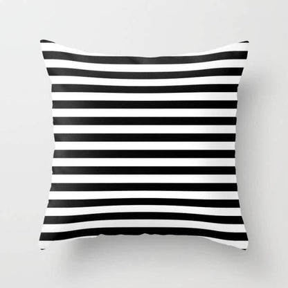 Modern black and white striped monochrome pattern pillow from Scorpius, featuring bold textile design for contemporary decor.