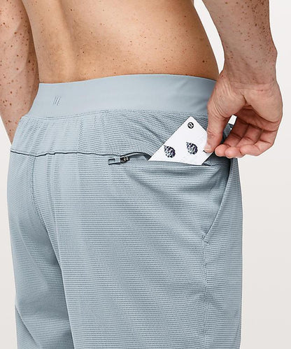 Sky Felix Skyblue 9-inch mesh shorts with a relaxed fit, shown on a model, perfect for casual or athletic wear.