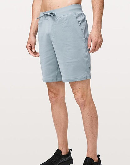 Sky Felix Skyblue 9-inch mesh shorts featuring a lightweight, breathable design, shown in a casual outdoor setting.