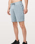 Sky Felix Skyblue 9-inch mesh shorts featuring a lightweight, breathable design, shown in a casual outdoor setting.