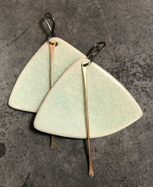 Handmade hypoallergenic lightweight ceramic statement earrings by Azure Nesoi, featuring sleek, modern jewelry design.