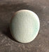 Adjustable handmade ceramic cocktail ring in teal with a bold statement design, crafted by Azure Nesoi.