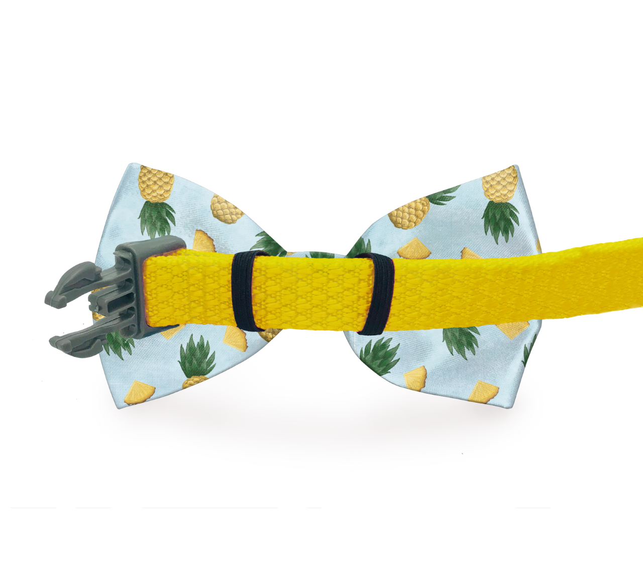 Yellow zigzag dog bow tie from Plum Semele, shown from the back on a leash or collar, featuring a playful print design.