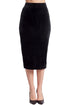 Black Tia Skirt by Peach Dionysus, a stretch velvet pencil skirt shown on a model, highlighting its sleek fit and smooth fabric.