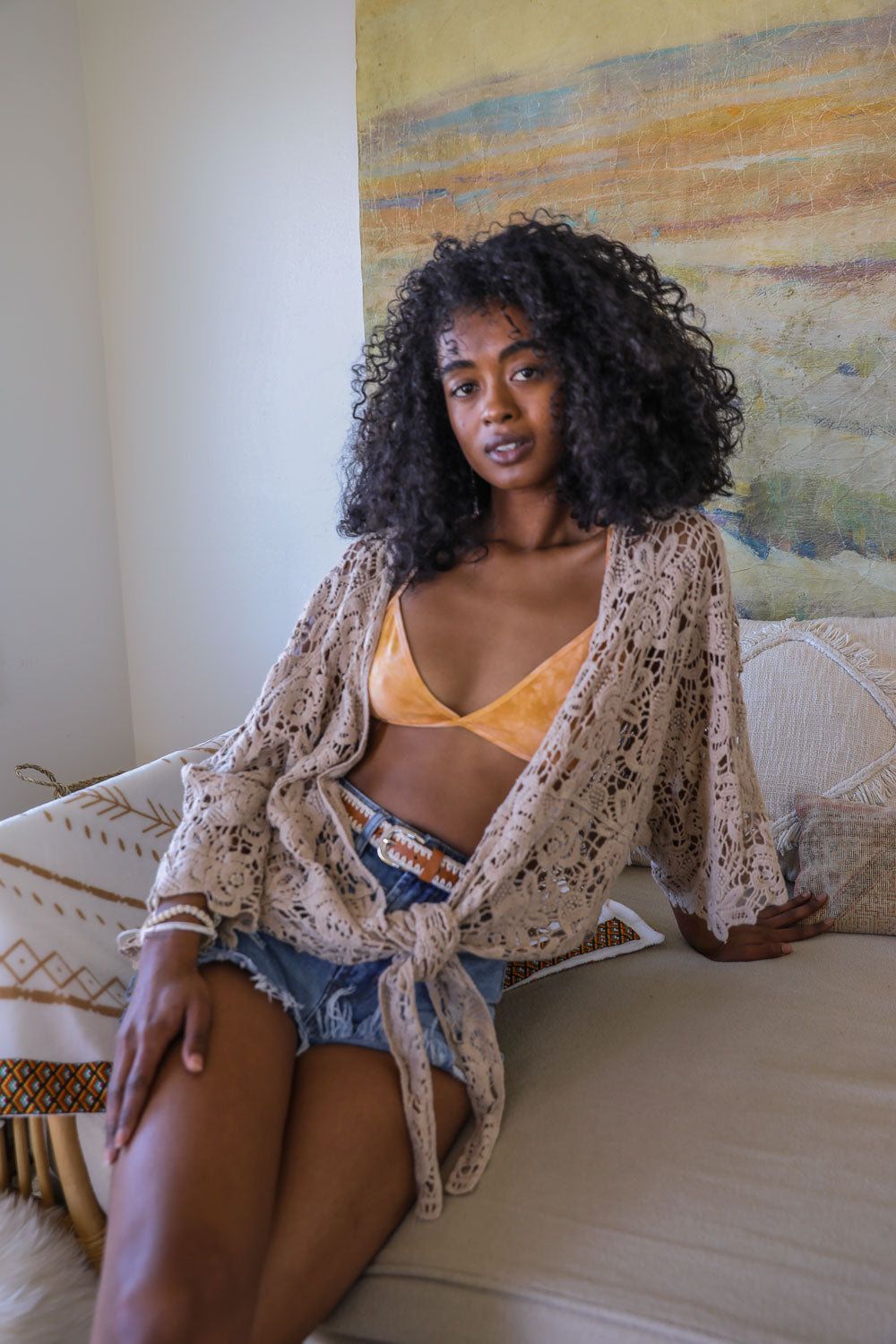 Tie-dye triangle style bralette by Periwinkle Aether showcasing soft fabric and vibrant tie-dye pattern in a close-up image.