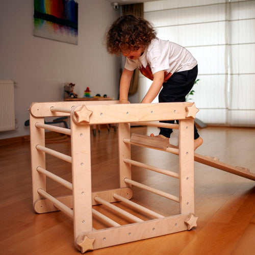 Red Oceanus transformable climbing cube with ramp, versatile furniture for kids to climb, explore, and play indoors.