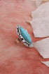 Turquoise Marquise Cut Silver Ring from Periwinkle Aether featuring a silver band and a prominent turquoise marquise-shaped gemstone.