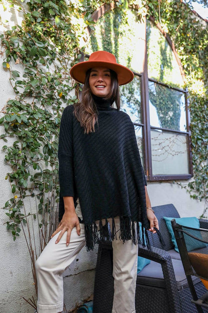 Periwinkle Aether sweater weather roll-neck poncho with turtleneck and frayed knit sleeves, cozy accessories for chilly days.