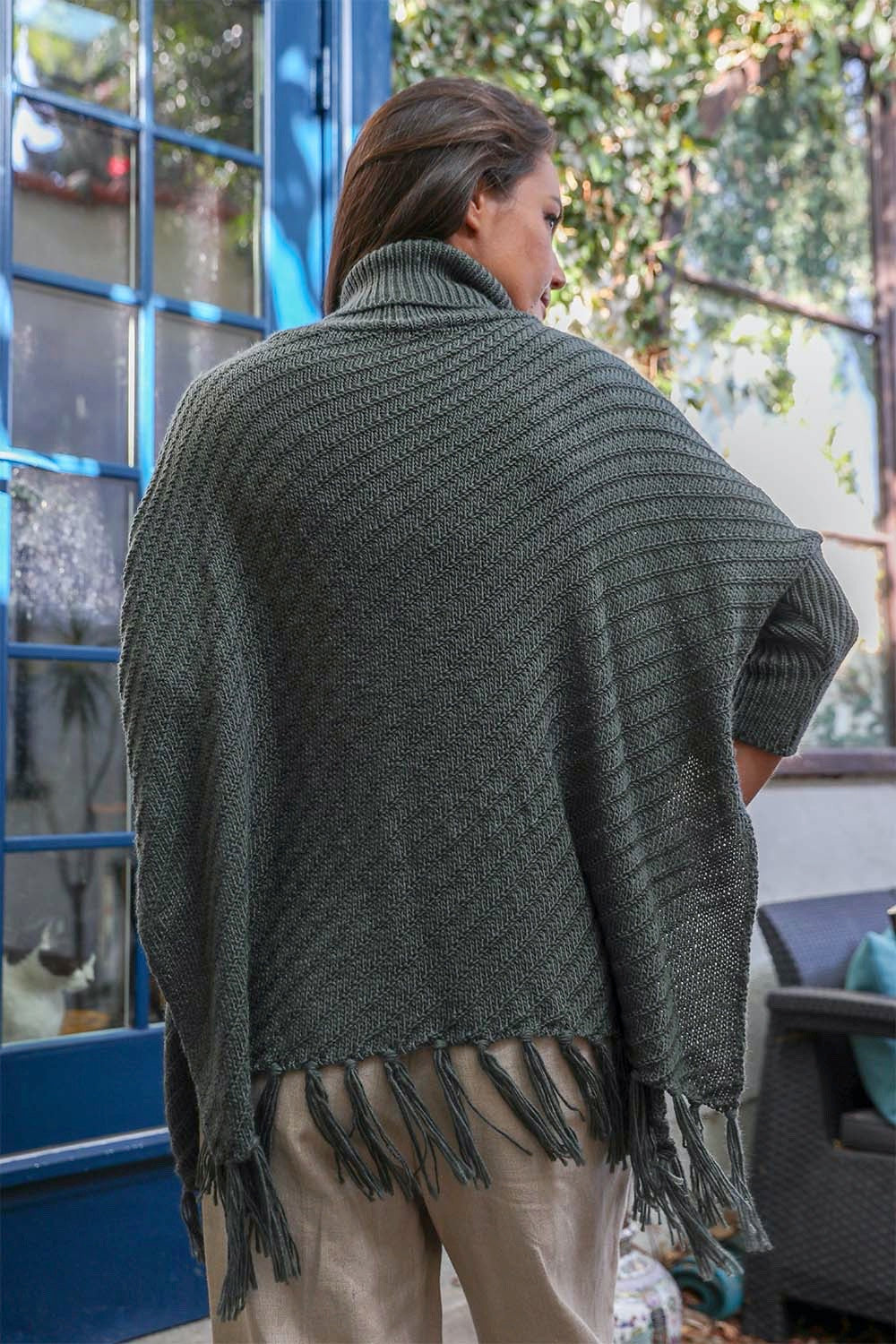 Periwinkle Aether Sweater Weather roll-neck poncho with turtleneck and knit frayed edges, stylish accessories for cozy fall outfits.