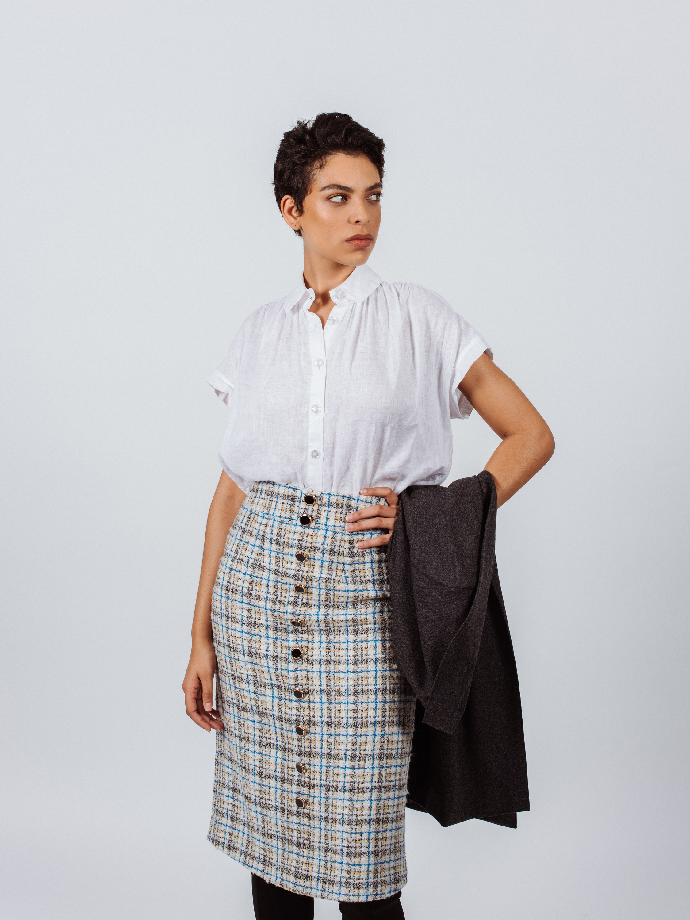 Women’s blue plaid tweed pencil skirt by Mauve Daisy, featuring a chic, tailored design perfect for stylish office or casual wear.