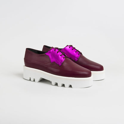 Red Electra Faced fuchsia leather platform creepers, stylish footwear with chunky soles and vibrant color, perfect for bold fashion statements.