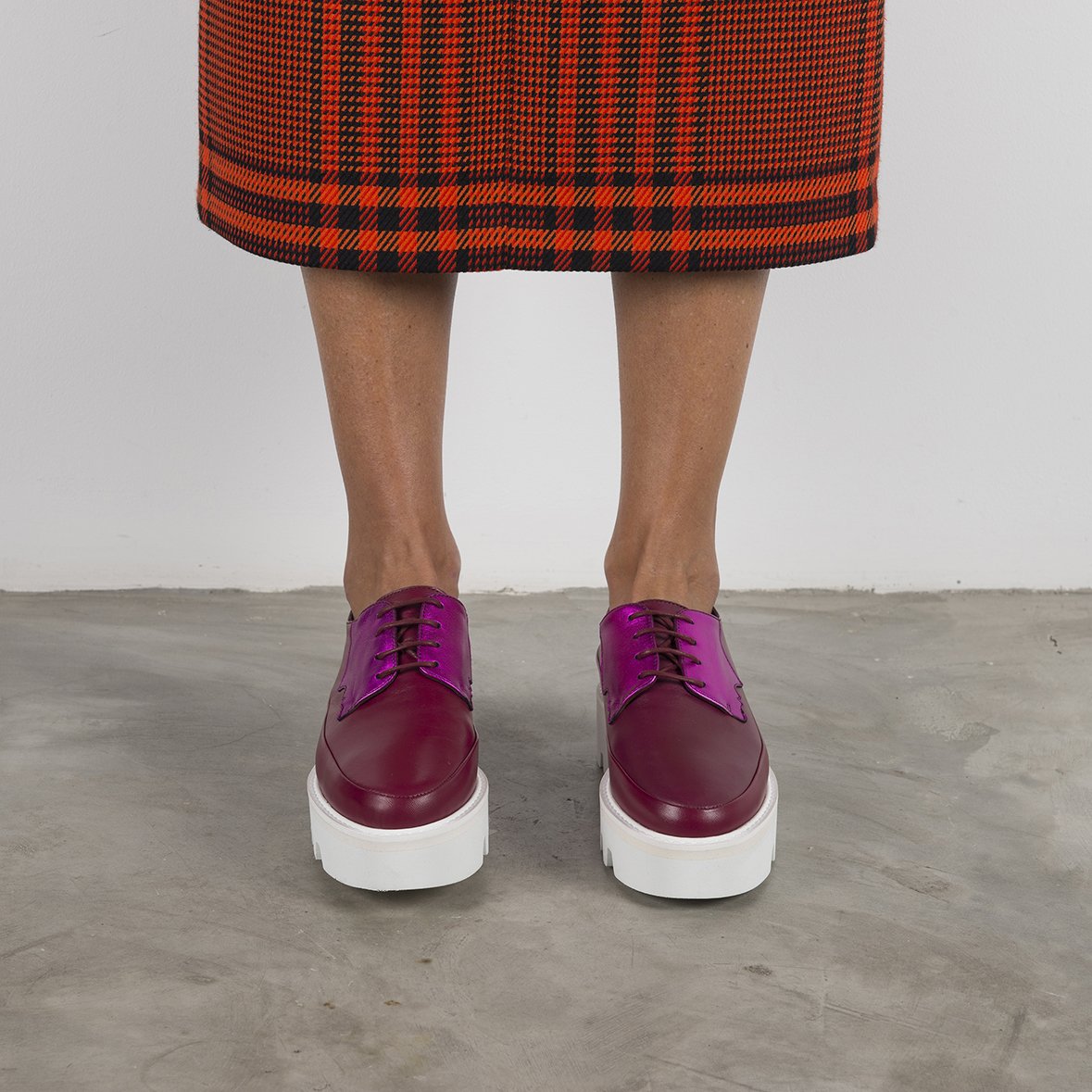 Fuchsia leather platform creeper shoes by Red Electra, featuring chunky soles and bold footwear design in a vibrant magenta color.