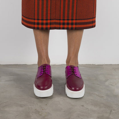 Fuchsia leather platform creeper shoes by Red Electra, featuring chunky soles and bold footwear design in a vibrant magenta color.