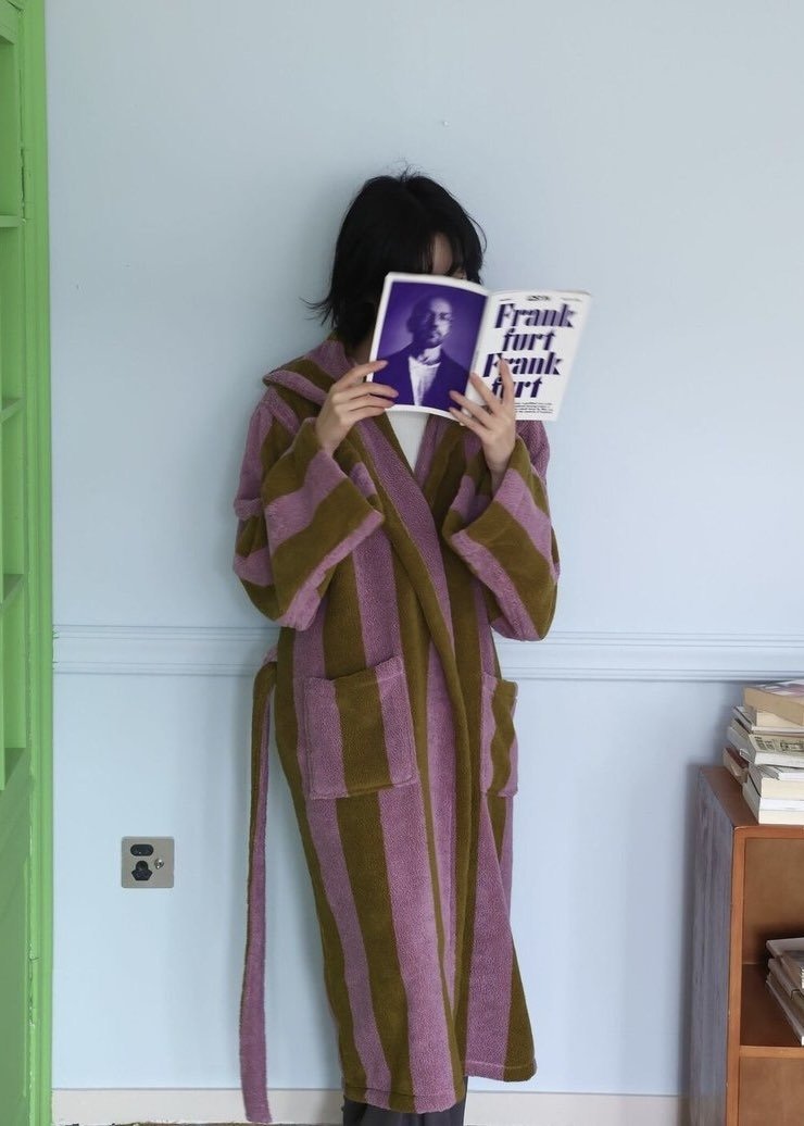 Inspecial Home ultra-soft retro whimsical stripe bath robe made of 100% organic long-staple cotton, showcasing cozy, colorful design.