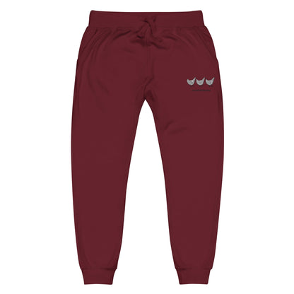 Maroon Jacki Easlick Three Chickens unisex fleece sweatpants with yellow Eleusis branding, front view showing relaxed fit.