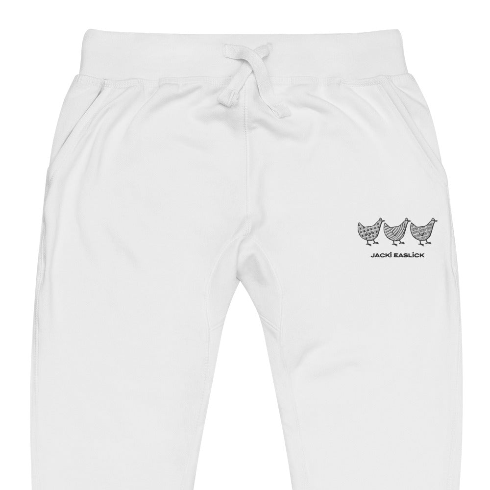 White Jacki Easlick Three Chickens unisex fleece sweatpants by Yellow Eleusis, shown in a close-up view.