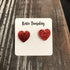 Red glitter broken heart earrings by Olive Felix, featuring bold, sparkly heart-shaped jewelry with a trendy, edgy design.