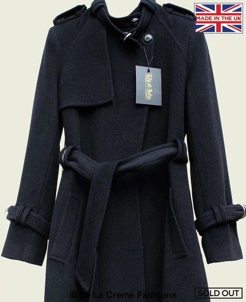 Black collarless trench coat by Rose Eleusis, tailored stylish design, shown on a model wearing it as a jacket or coat.