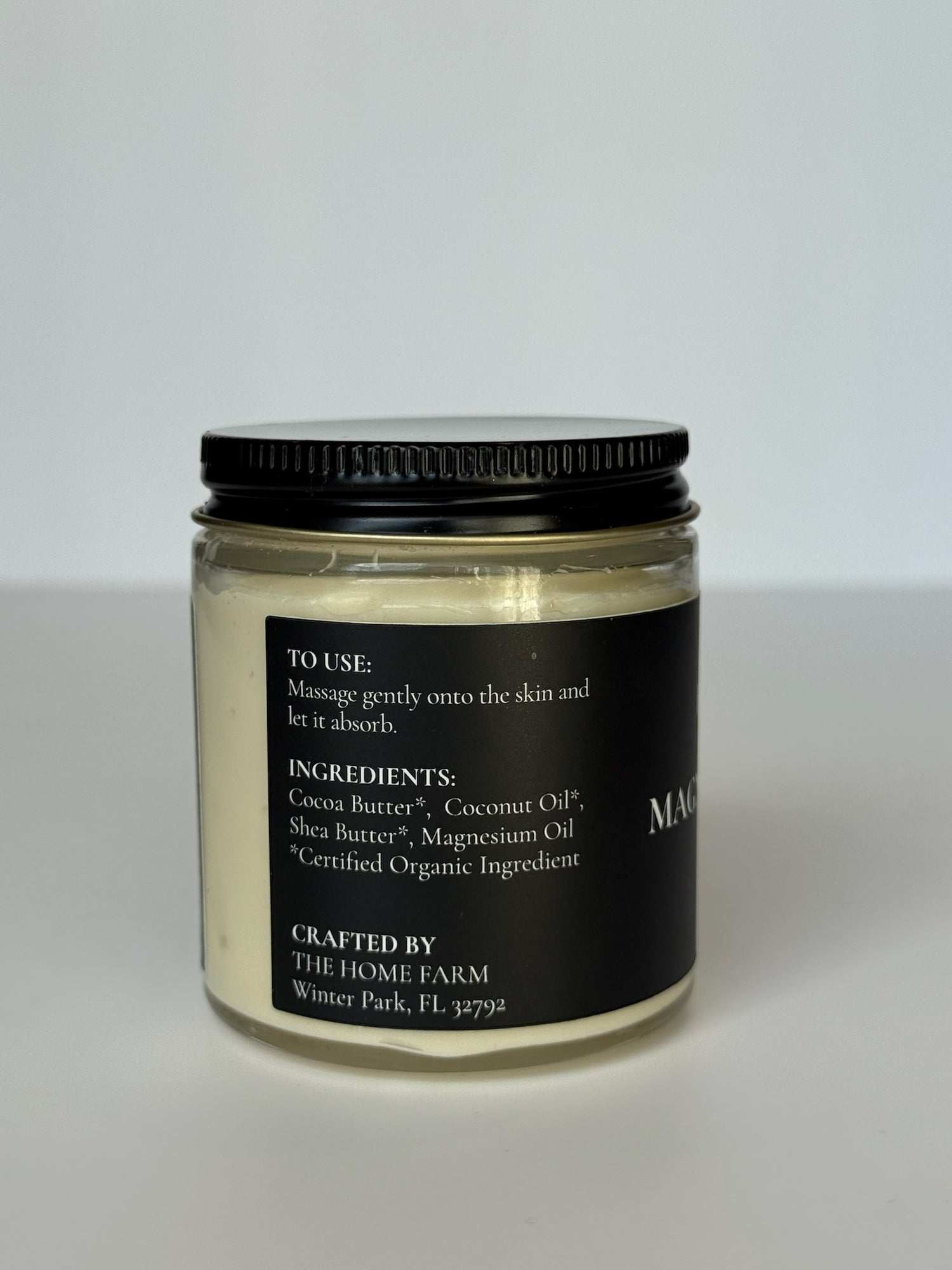 DC-The Home Farm Magnesium Body Butter in a jar, showcasing a smooth, creamy texture for nourishing skin in a beauty product image.