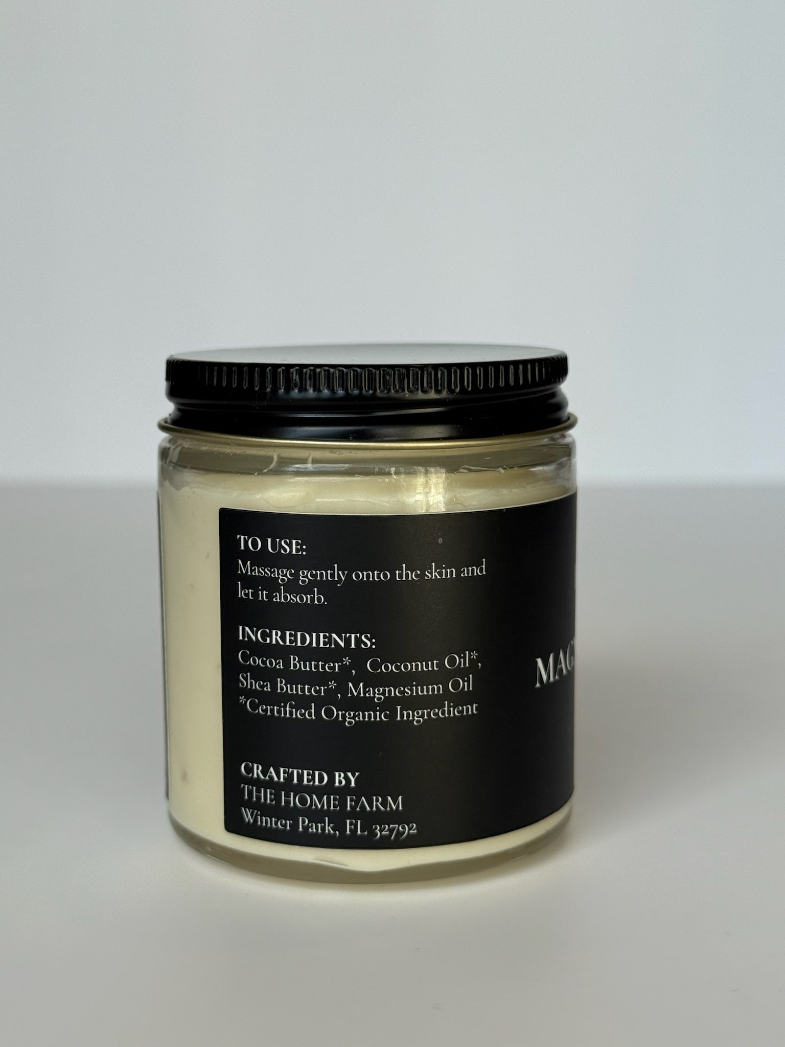DC-The Home Farm Magnesium Body Butter in a jar, showcasing a smooth, creamy texture for nourishing skin in a beauty product image.