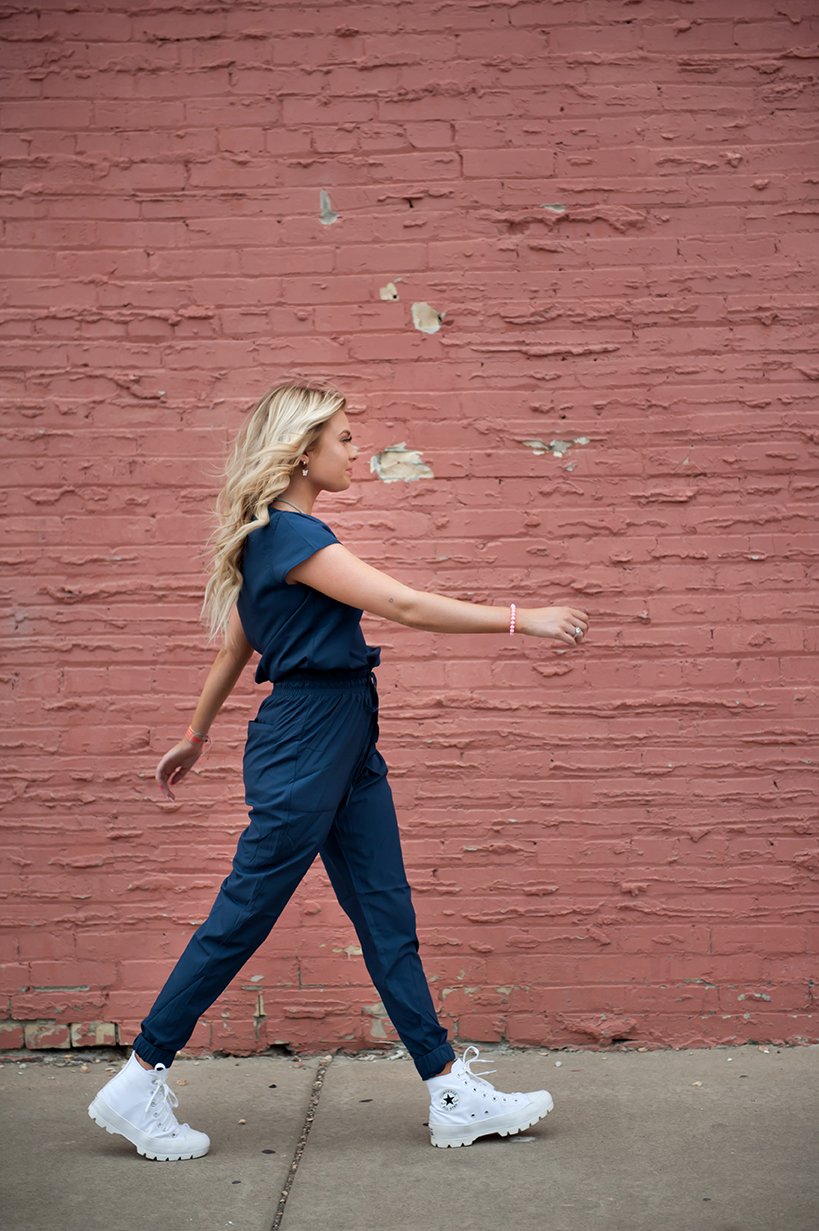 Lavender Danae navy DT Unity jumpsuit for women, featuring a stylish and comfortable design with a fitted silhouette.