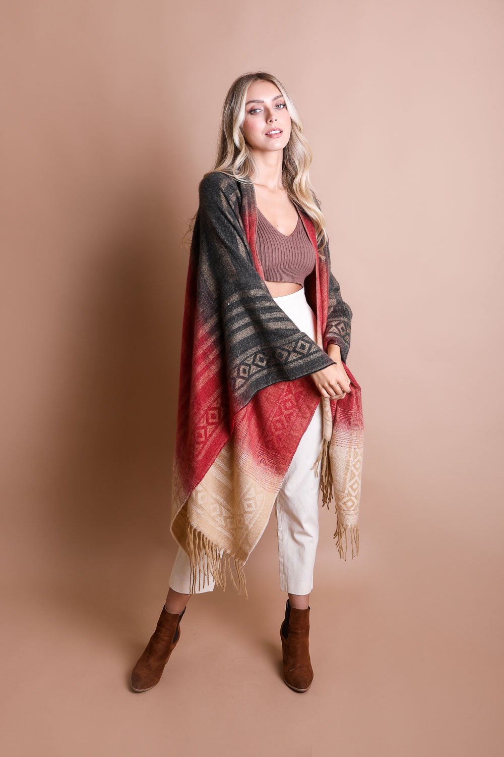 Colorful Western-style tassel serape with vibrant colorblend patterns, designed as a stylish accessory by Periwinkle Aether.