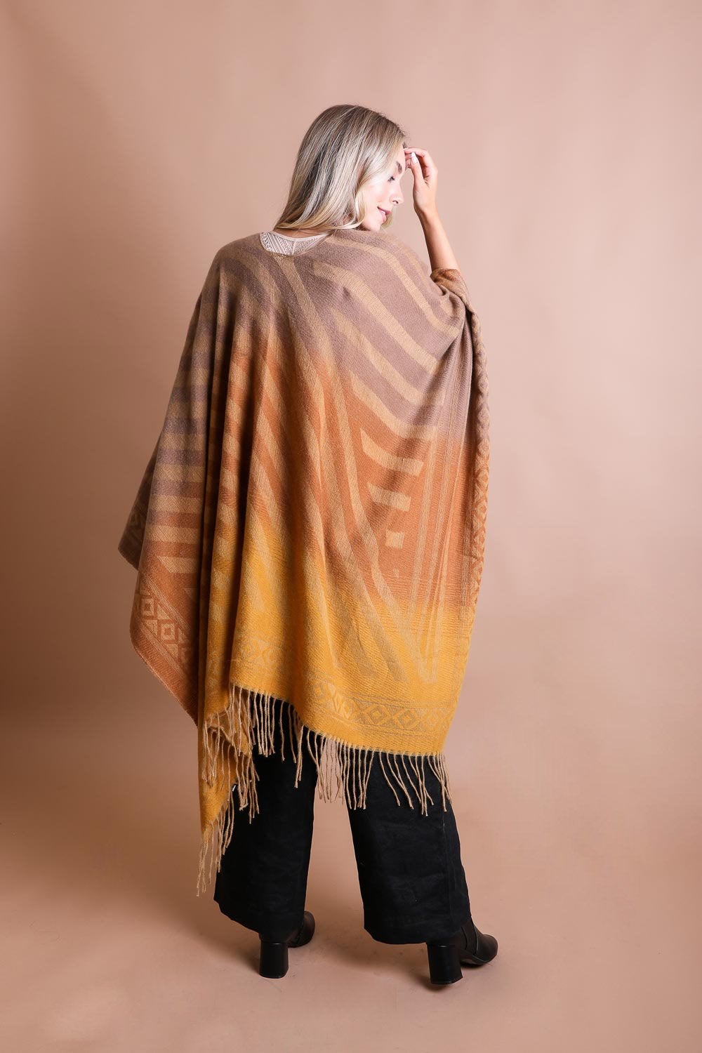Colorful Western-style tassel serape accessory with vibrant color blends and decorative tassels, by Periwinkle Aether.