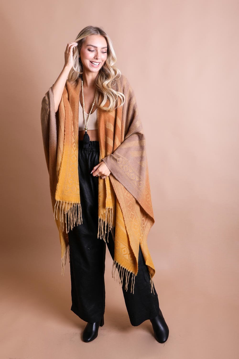 Colorful Western-style tassel serape accessory with vibrant color blends and fringe details, by Periwinkle Aether.