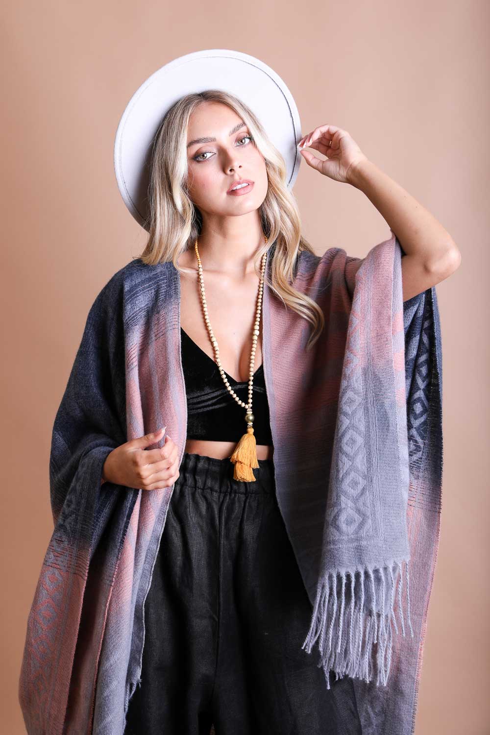 Colorful Western-style tassel serape accessory from Periwinkle Aether with vibrant color blending and fringed tassels.
