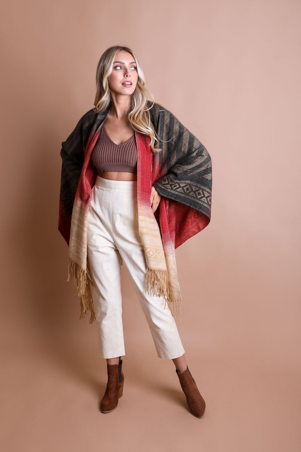 Colorful Western-style tassel serape accessory with vibrant color blends and decorative tassels, by Periwinkle Aether.