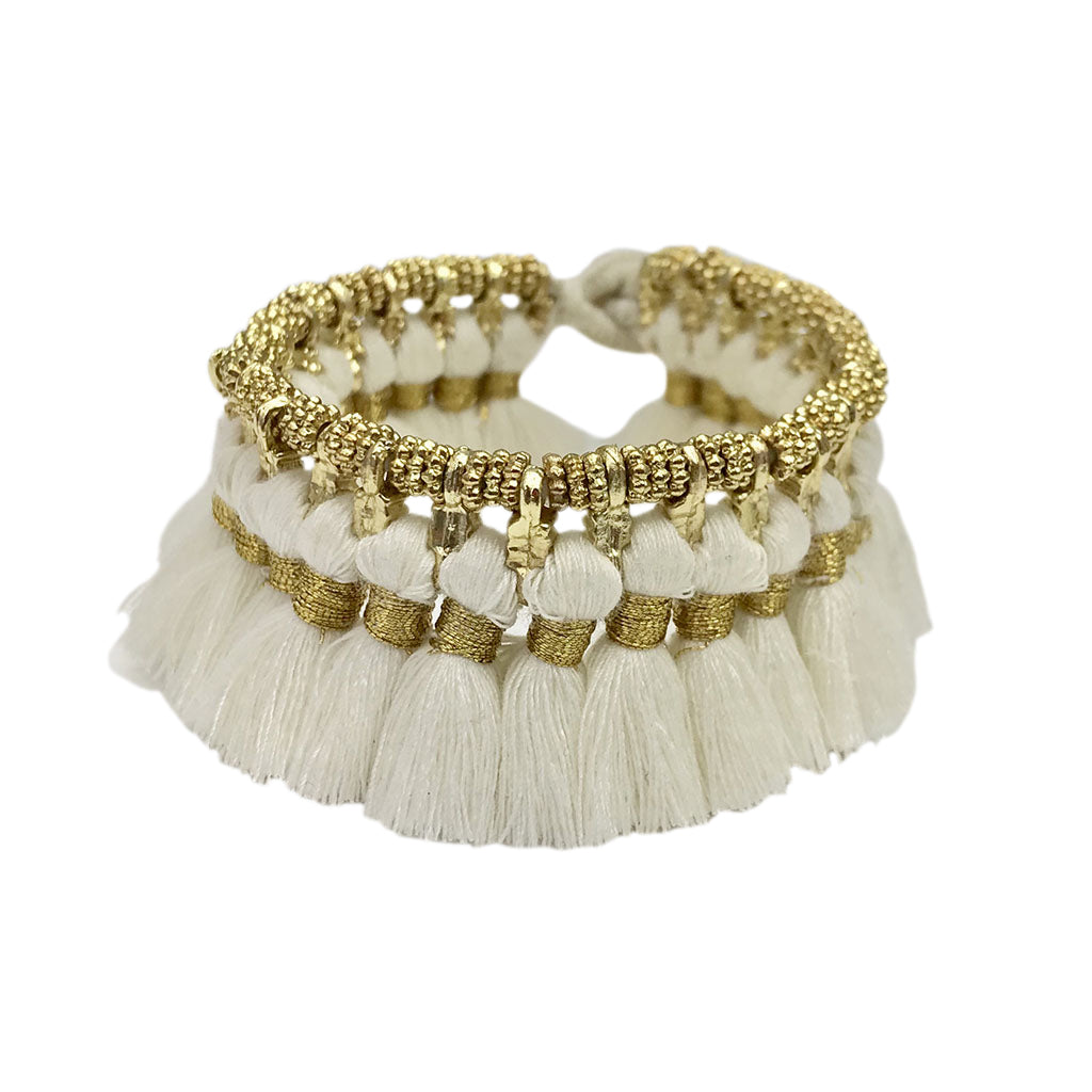 Ariel Kyra Tassel Bracelet featuring white tassels and a delicate chain, stylish accessory for casual or boho outfits.
