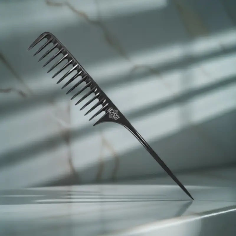 Peach Clymene wide-tooth detangler comb for gentle, tangle-free styling of hair or wigs, with wide spaced teeth for smooth combing.