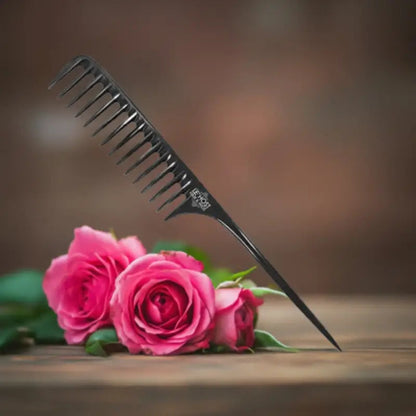 Peach Clymene wide tooth detangler comb for gentle, tangle-free hair styling and wig grooming, with wide spaced teeth.