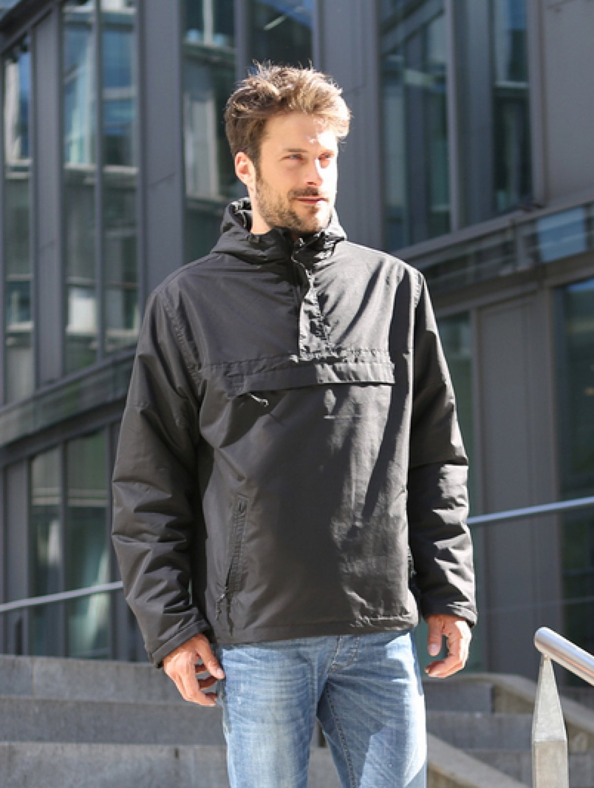 Callisto Essential Windbreaker in multiple colors, lightweight jacket with adjustable hood and front pockets, suitable for outdoor wear.