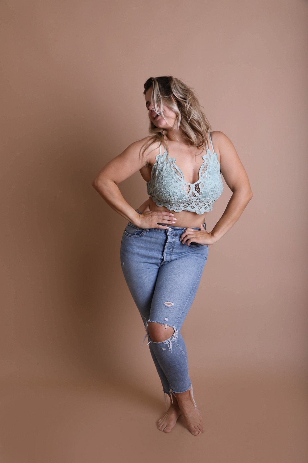 Plus crochet lace longline bralette by Periwinkle Aether featuring padded, sage-colored lace with intricate crochet details.