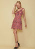 Lemon Hera Wax Flower Mini Ruffled Sleeveless Dress in vibrant floral pattern, sleeveless design, and ruffled hem.