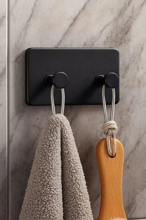 Set of four Gold Penelope self-adhesive wall hooks for bathroom and kitchen, easy to install, perfect for hanging accessories.