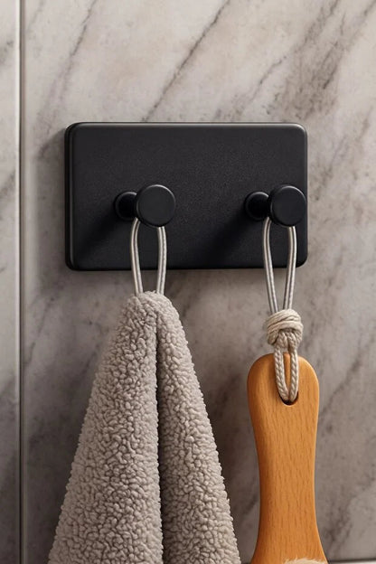 Set of four Gold Penelope self-adhesive wall hooks for bathroom and kitchen, easy to install, perfect for hanging accessories.