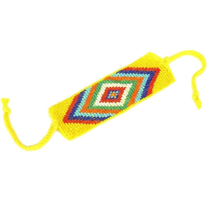 Yellow geometric beaded cuff bracelet by Ariel featuring a modern design with intricate beading and a stylish, bold look.
